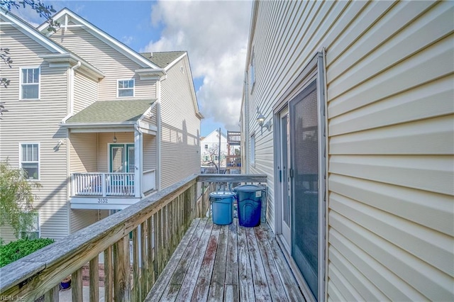 wooden deck featuring a residential view