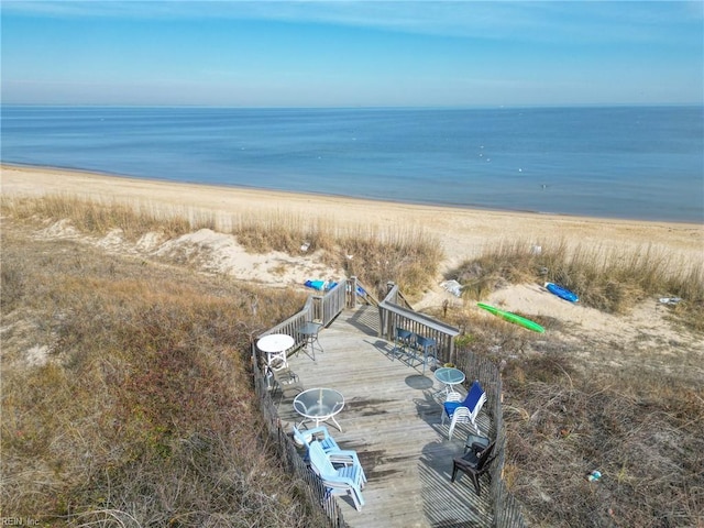 bird's eye view featuring a water view and a view of the beach