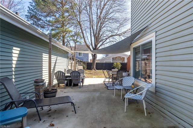 view of patio featuring fence