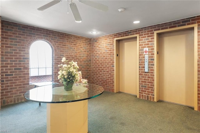 255 College Cross Rd Unit 89, Norfolk, VA 23510 - unfurnished dining area with carpet floors, recessed lighting, elevator, and brick wall