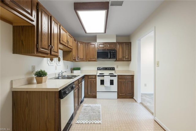255 College Cross Rd Unit 89, Norfolk, VA 23510 - kitchen featuring white range with electric stovetop, visible vents, a sink, black microwave, and dishwasher