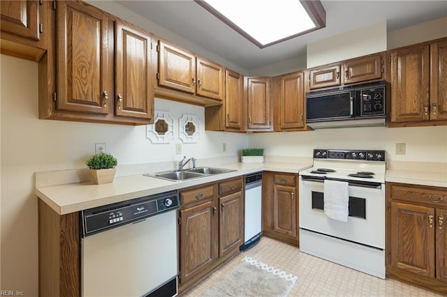 255 College Cross Rd Unit 89, Norfolk, VA 23510 - kitchen featuring white appliances, light floors, a sink, and light countertops