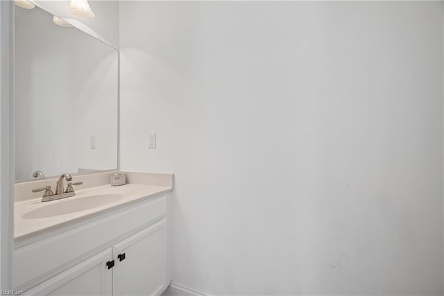 bathroom with baseboards and vanity