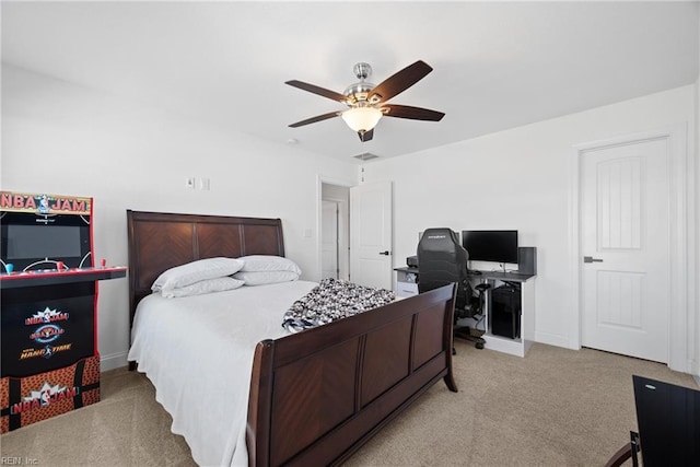 bedroom with visible vents, baseboards, a ceiling fan, and light colored carpet