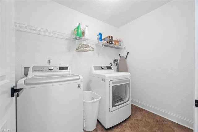 laundry area featuring laundry area, baseboards, and independent washer and dryer