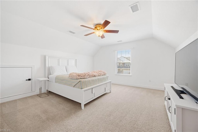 bedroom featuring lofted ceiling, ceiling fan, visible vents, and light colored carpet