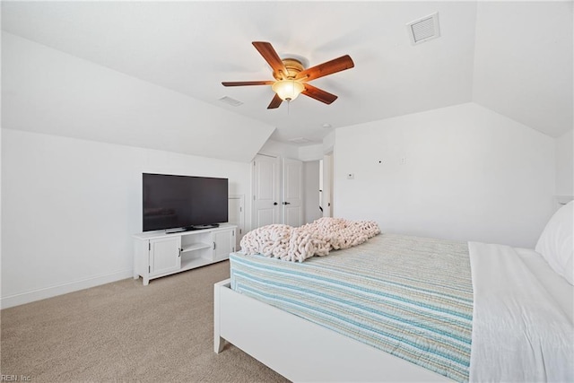 bedroom with light carpet, visible vents, baseboards, lofted ceiling, and ceiling fan