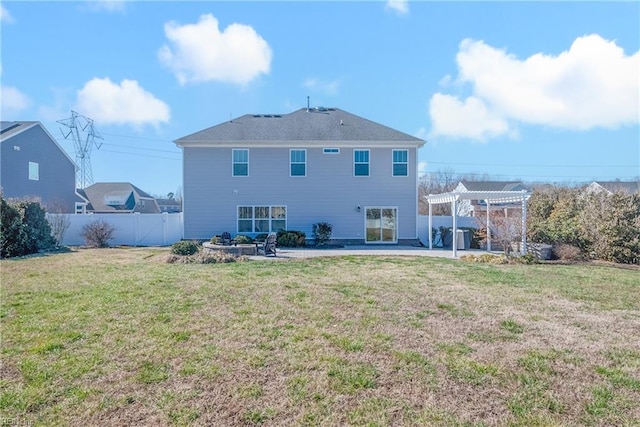 rear view of house with a lawn, fence, a patio, and a pergola