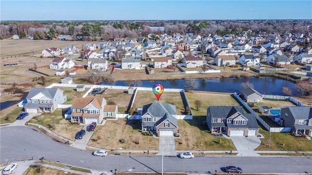 bird's eye view with a water view and a residential view