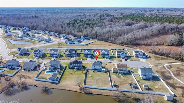 birds eye view of property with a water view and a residential view