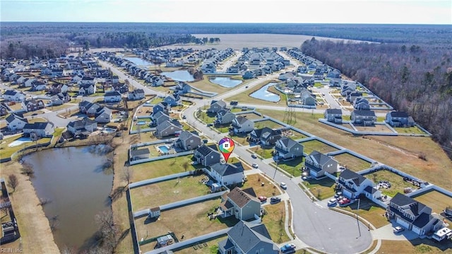 bird's eye view with a water view and a residential view