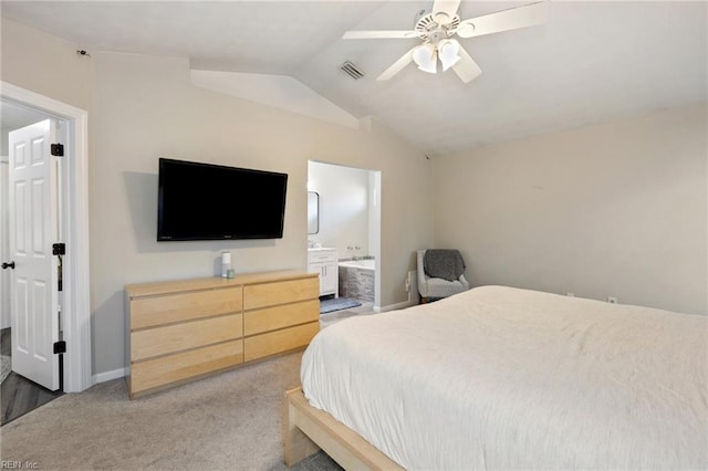 bedroom with visible vents, a ceiling fan, connected bathroom, lofted ceiling, and light colored carpet