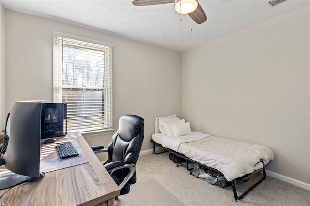 carpeted bedroom featuring ceiling fan and baseboards