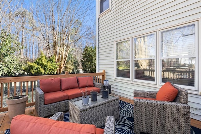 wooden deck featuring an outdoor hangout area