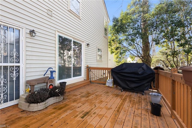 wooden deck with grilling area