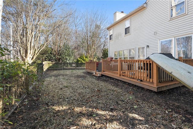 view of yard featuring fence and a wooden deck