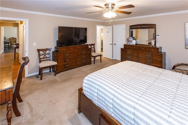 bedroom featuring ornamental molding, light colored carpet, baseboards, and a ceiling fan