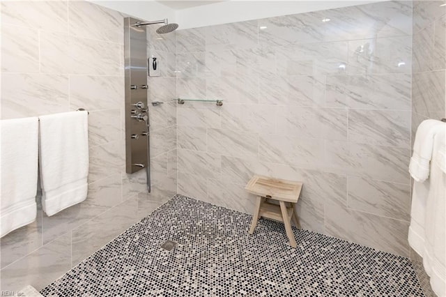 bathroom with a tile shower