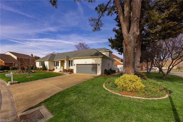 single story home with driveway, an attached garage, fence, a front yard, and stucco siding