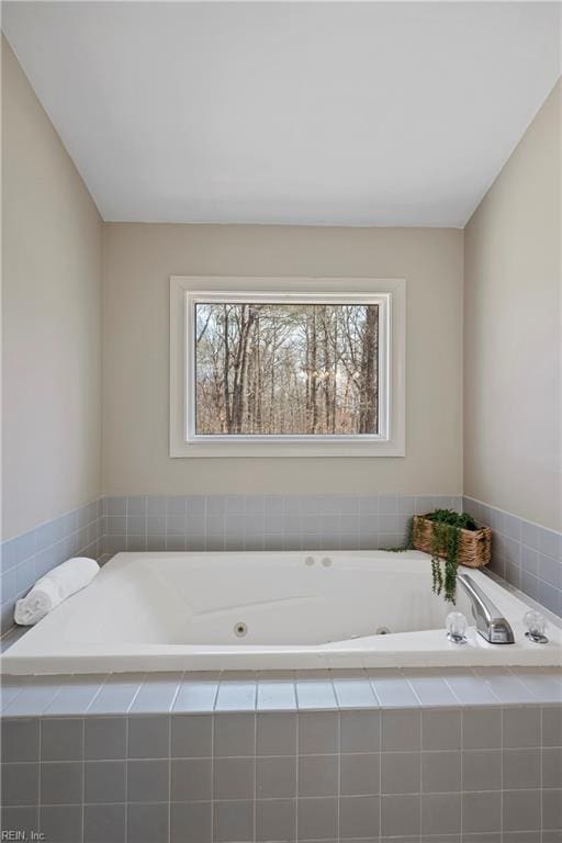 full bath featuring a tub with jets