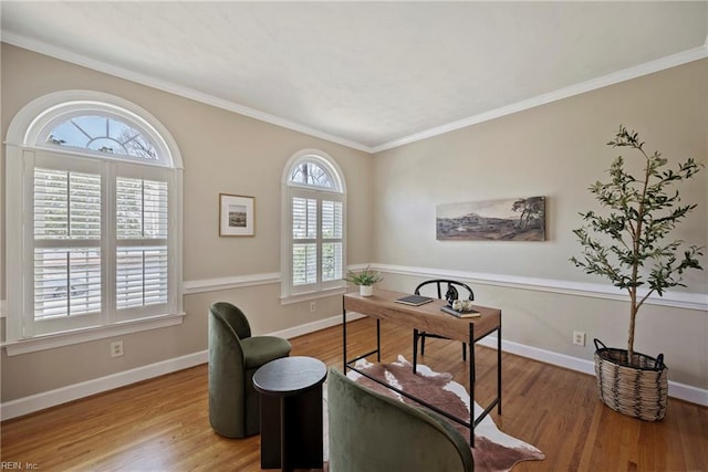 office area with baseboards, wood finished floors, and ornamental molding