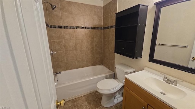 bathroom featuring tub / shower combination, vanity, and toilet