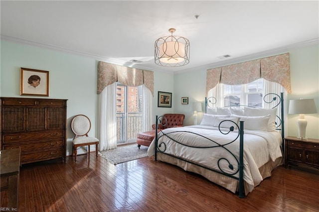 bedroom with access to outside, visible vents, crown molding, and wood finished floors