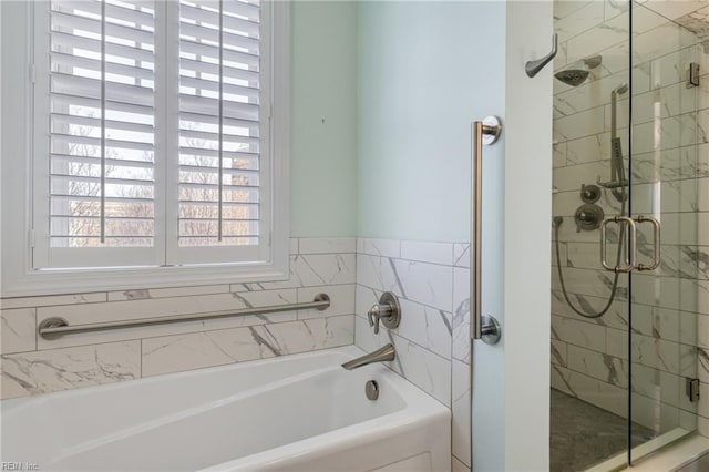 full bathroom featuring a stall shower and a garden tub