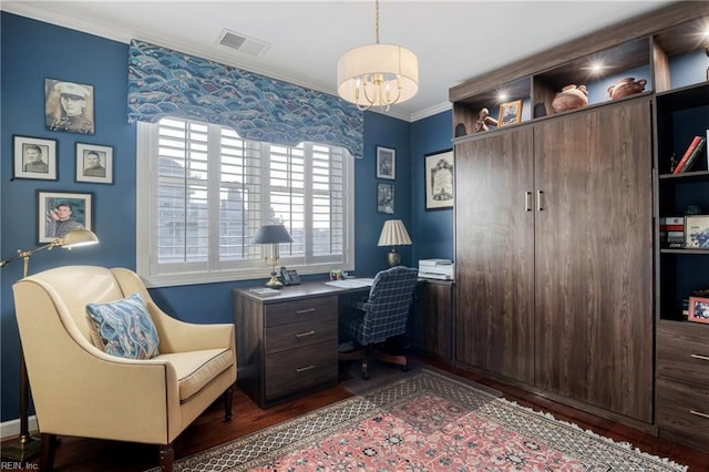 office with a notable chandelier, visible vents, crown molding, and wood finished floors