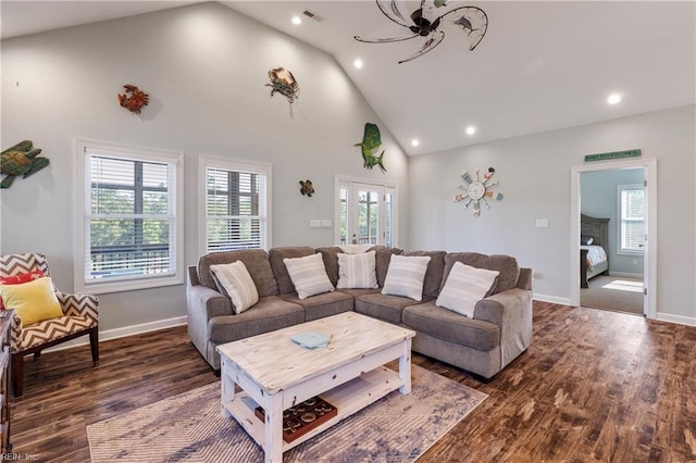 living area featuring high vaulted ceiling, wood finished floors, visible vents, and recessed lighting