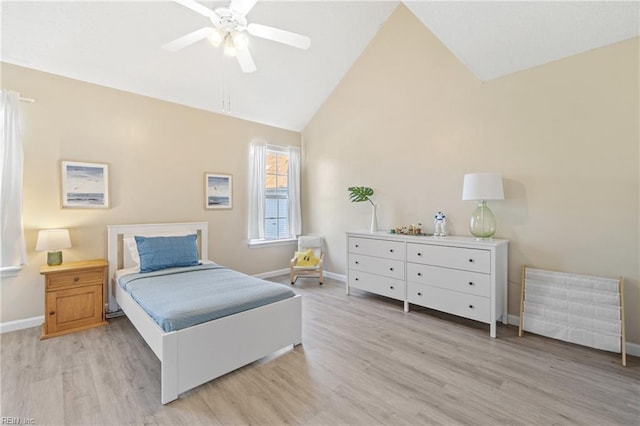 bedroom with a ceiling fan, light wood-style flooring, and baseboards