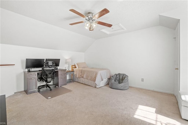 bedroom featuring lofted ceiling, light carpet, and attic access