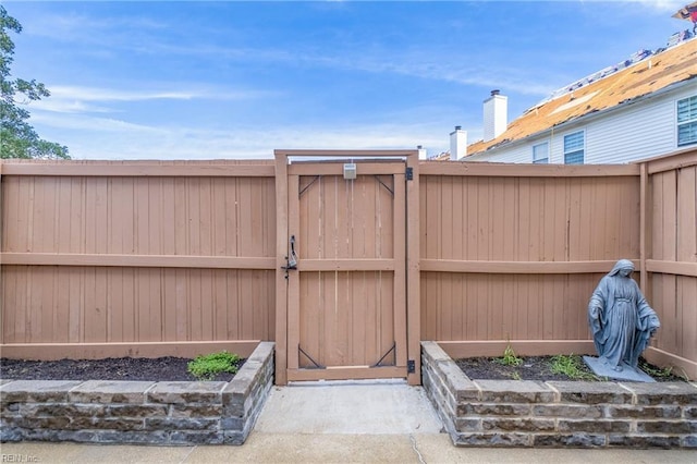 view of gate featuring fence