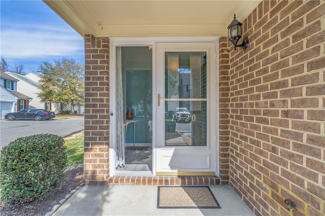 entrance to property with brick siding