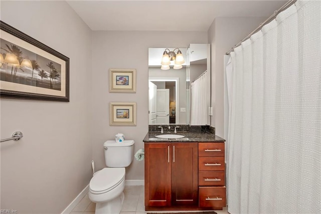 full bath with toilet, tile patterned flooring, baseboards, and vanity