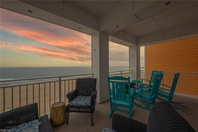 balcony with a beach view and a water view