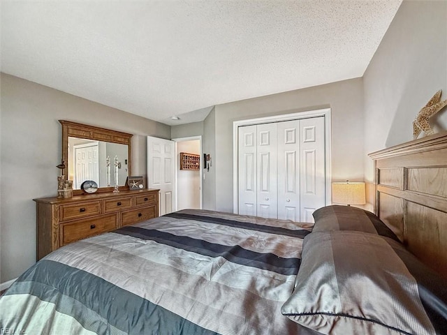 bedroom featuring a closet and a textured ceiling