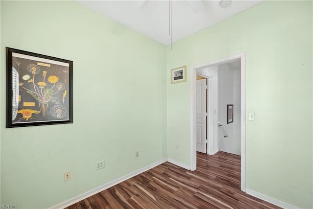 unfurnished bedroom with baseboards and wood finished floors