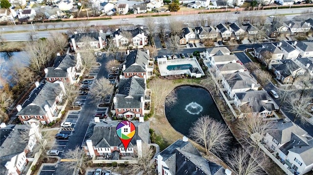 aerial view featuring a residential view and a water view