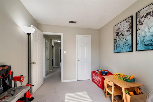 game room featuring carpet flooring, visible vents, and baseboards