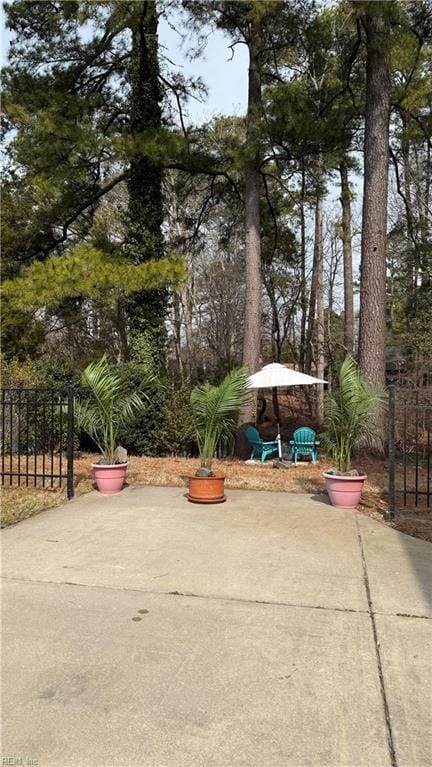 view of community featuring a patio area and fence