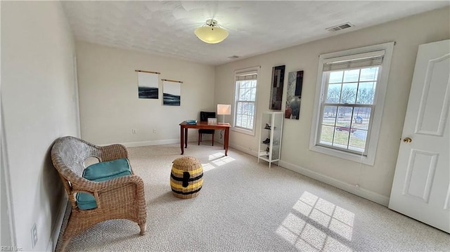 sitting room featuring carpet, baseboards, and visible vents