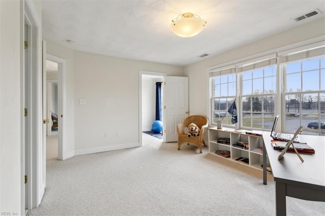 interior space with carpet floors, visible vents, and baseboards