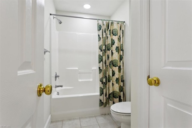 full bath featuring shower / bath combo, tile patterned flooring, and toilet