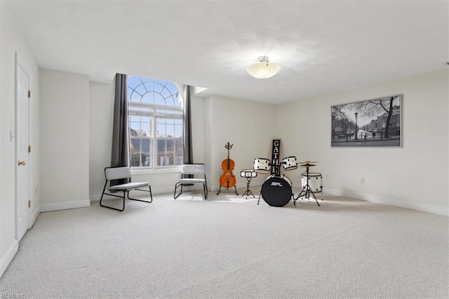 interior space with carpet and baseboards