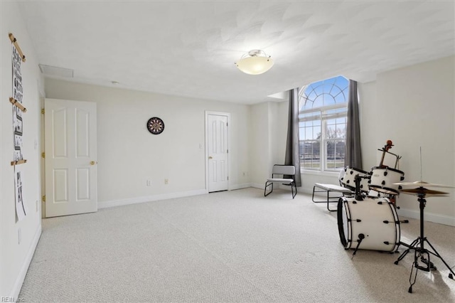 living area with carpet and baseboards