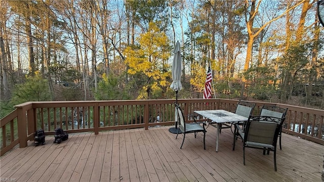 wooden deck featuring outdoor dining space