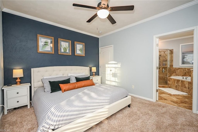 carpeted bedroom with ensuite bath, baseboards, ornamental molding, and a ceiling fan