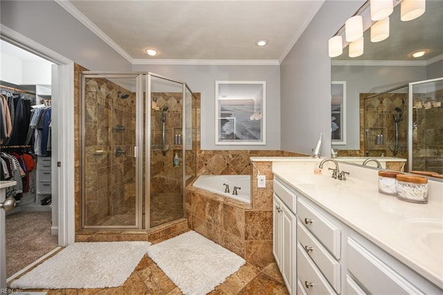 bathroom featuring ornamental molding, a stall shower, a sink, and a bath