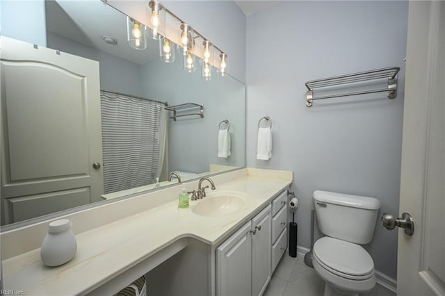 full bathroom featuring baseboards, vanity, toilet, and tile patterned floors